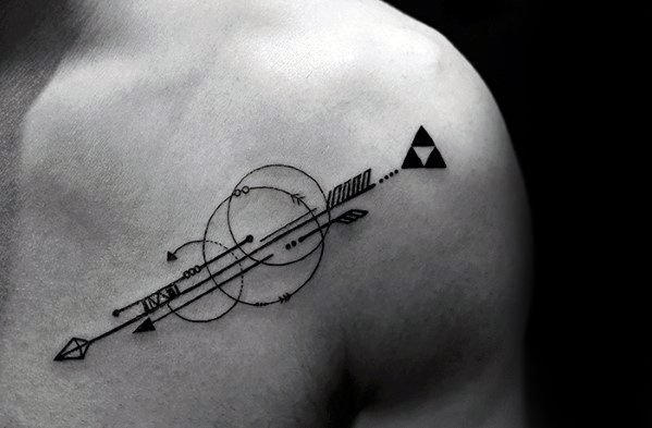 Geometric arrow tattoo on the shoulder with overlapping circles, fine linework, and a bold triangle cluster near the arrowhead.