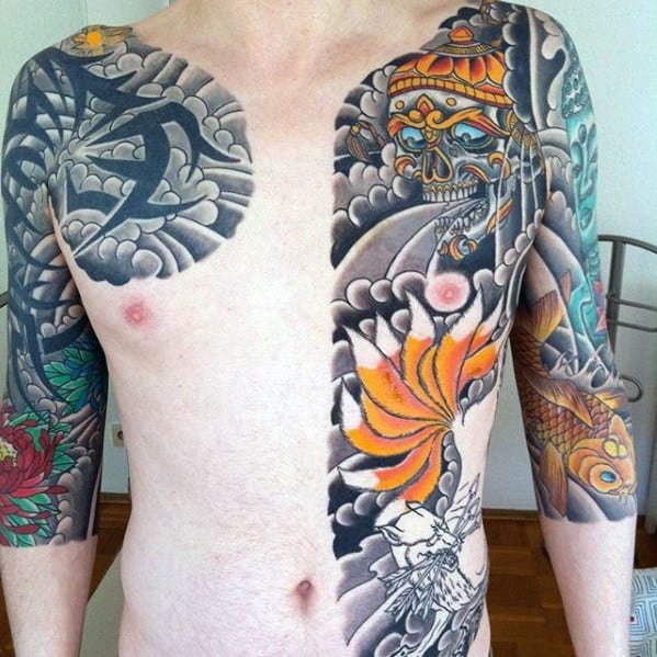 Tibetan skull tattoo design with vibrant orange lotus, swirling clouds, and detailed koi fish sleeve on a man's chest and arms.