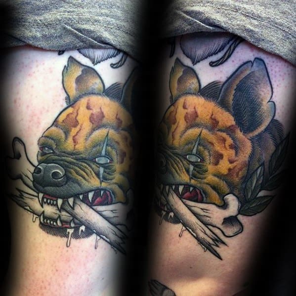 Bold neo-traditional hyena tattoo with intense eyes, biting into a broken bone, featuring heavy outlines, dripping saliva, and earthy tones.