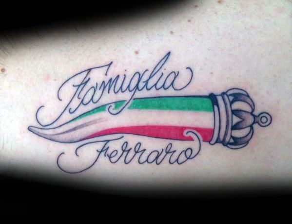 Italian horn tattoo with a crown, featuring the tricolor flag and 'Famiglia Ferraro' script, symbolizing heritage and protection.