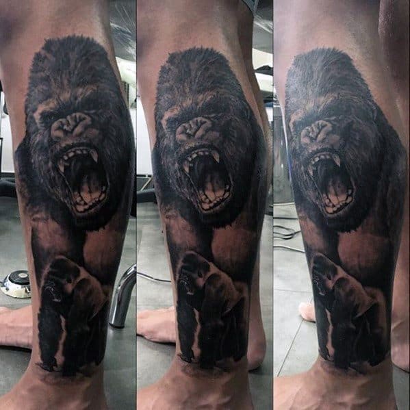 Realistic King Kong tattoo on calf showing a roaring gorilla above a calm Kong holding Ann Darrow in his hand.