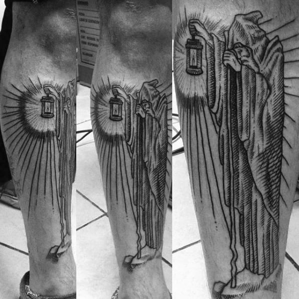 Black ink leg tattoo of the hooded hermit holding a glowing lantern, inspired by Led Zeppelin’s 'Stairway to Heaven' artwork.