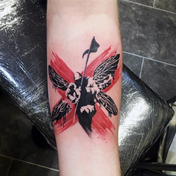 Black and red Linkin Park-inspired tattoo featuring a soldier with wings holding a flag, styled with a grunge brushstroke background.