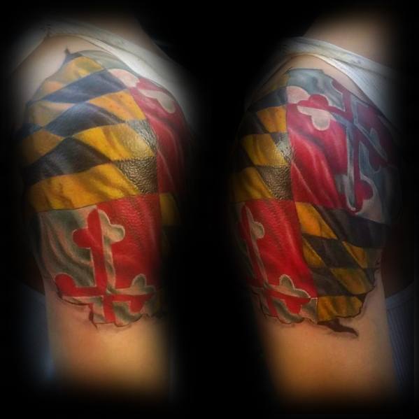 Maryland flag tattoo on upper arm with a torn skin effect, creating a realistic 3D look with bold red, black, and yellow colors.