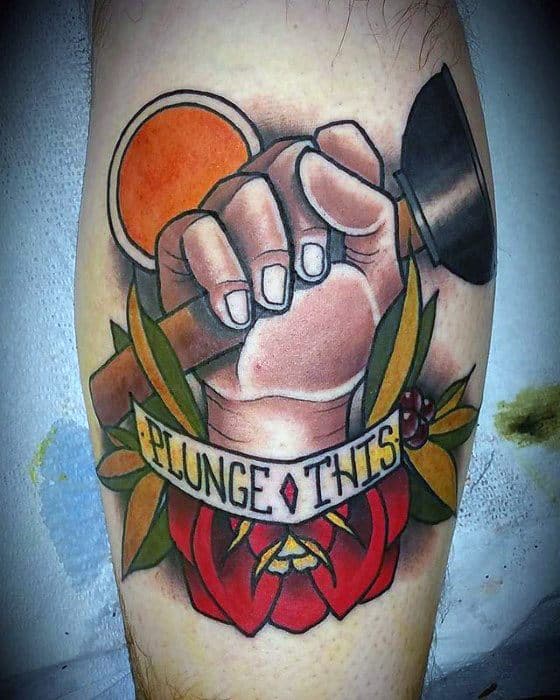 Colorful tattoo of a hand holding a plunger above a red rose with a banner that reads PLUNGE THIS in bold lettering.