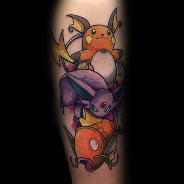 Colorful Pokémon tattoo featuring Magikarp, Espeon, and Raichu in a bold, dynamic composition on the forearm.