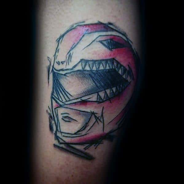 Sketch-style tattoo of the Red Power Ranger helmet with bold black lines, shading, and red highlights on the upper arm.