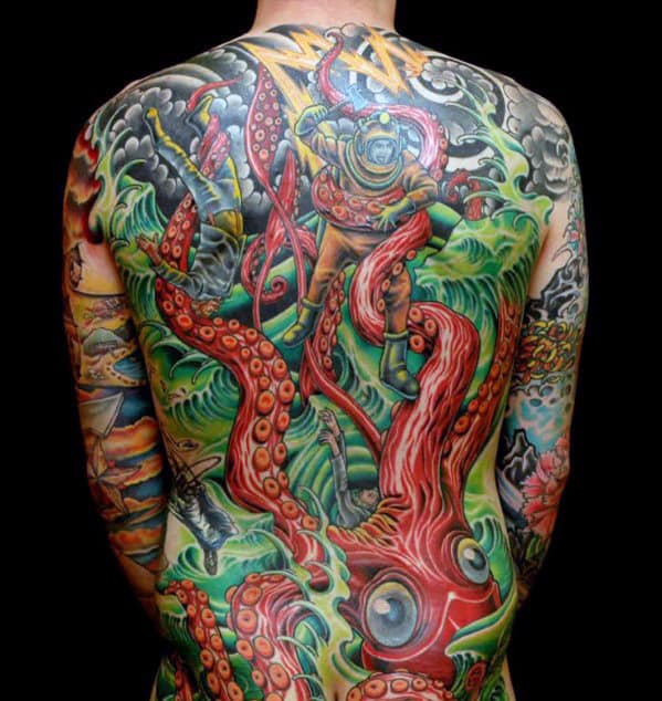 Vivid back tattoo of a diver battling a giant octopus with underwater scenes