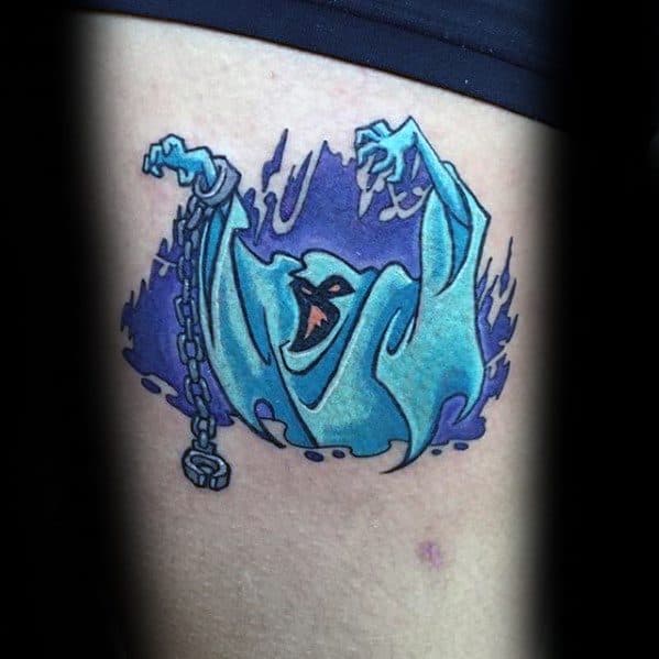 Colorful tattoo of a ghost from Scooby-Doo with raised arms and broken chains, surrounded by a dark purple shadowy aura.