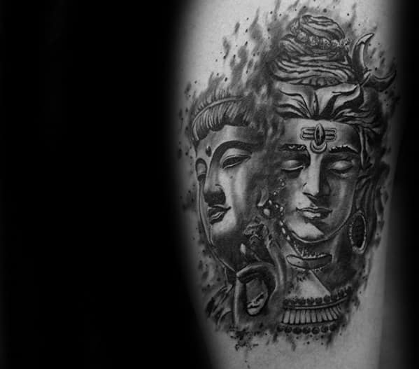 Dual-faced Lord Shiva tattoo with a smoky, abstract style blending two serene expressions, detailed with the third eye and sacred symbols.
