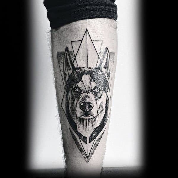 Geometric Siberian Husky tattoo on a man's leg, featuring bold blackwork, intricate line shading, and overlapping triangles for a modern look.