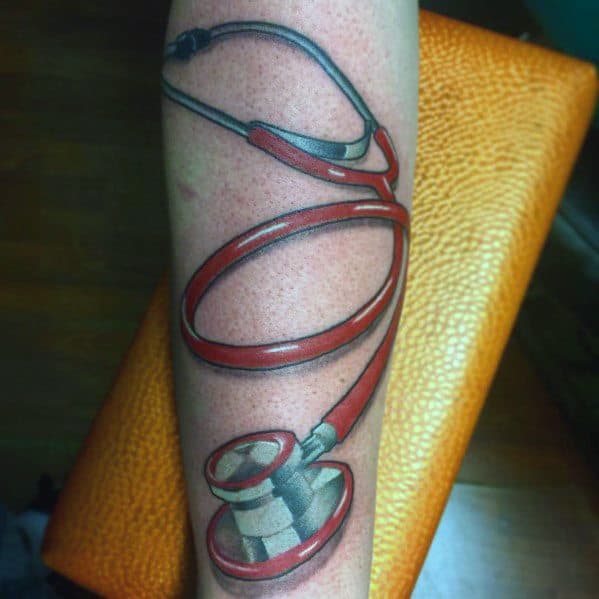 Vibrant red stethoscope tattoo on the forearm, featuring a realistic design that represents a deep commitment to the medical profession.