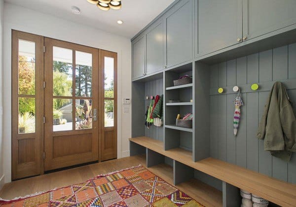bright airy gray cabinet mudroom with bench seating