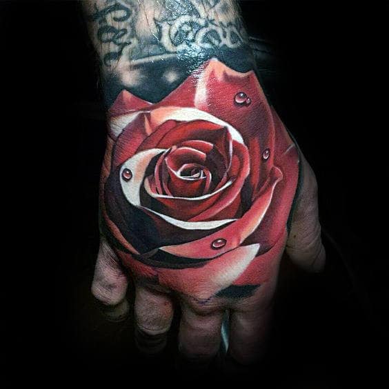 Realistic rose tattoo with water droplets on a hand