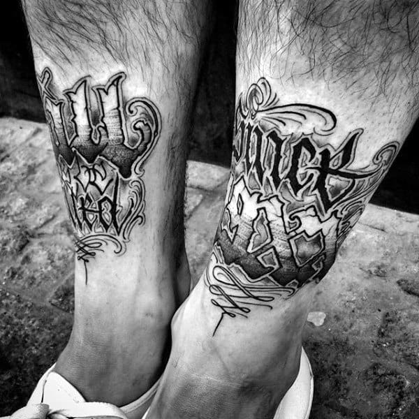 Amazing Shin Tattoo Lettering Design On Man