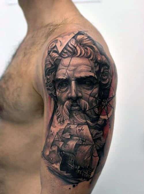 Arm tattoo featuring a detailed portrait of a bearded man and a sailing ship