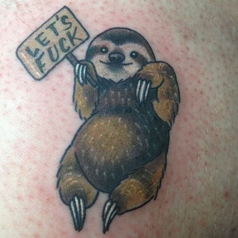 A colorful tattoo of a smiling sloth holding a sign that reads 'LET'S F***,' designed in a humorous and bold style.