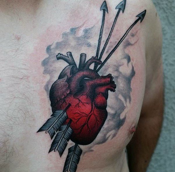 Vivid red anatomical heart tattoo on the chest pierced by three arrows, with smoky shading for a dramatic visual effect.