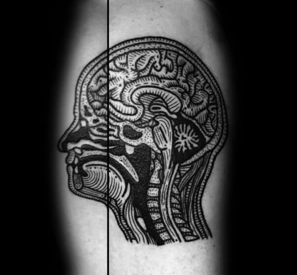 Black ink tattoo of a human head cross-section showing the brain, spine, and nasal cavity in a bold, anatomical illustration style.