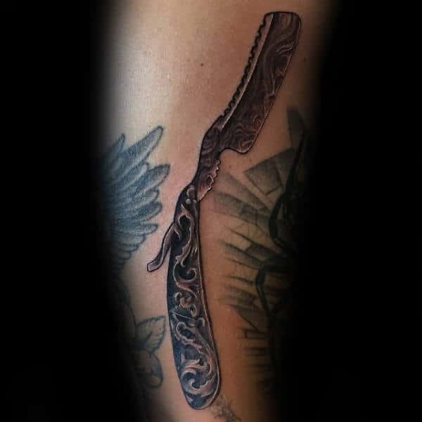 Ancient Carvings On Straight Razor Blade Tattoo Male Forearms