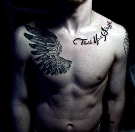 Man with wing tattoo on left chest and "Trust Your Struggle" tattooed on clavicle