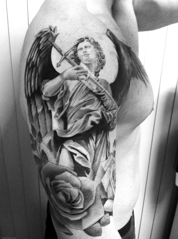 Black and grey arm tattoo of an angel with roses and a sword
