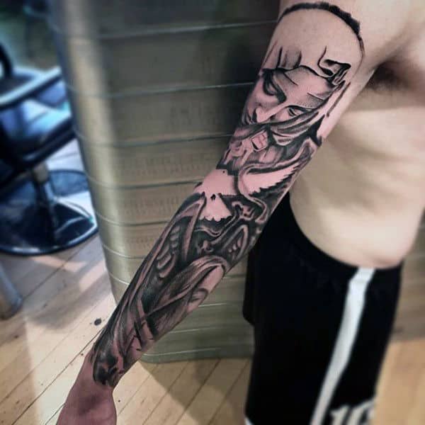 Tattoo of a samurai warrior extends down a man's arm