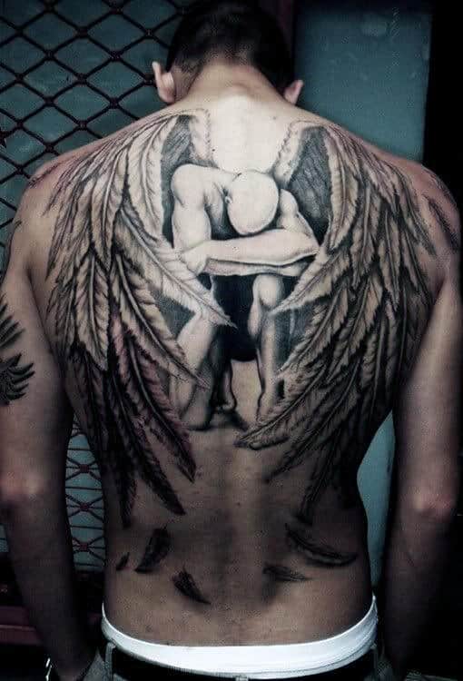 Man with large angel wings tattoo covering his entire back