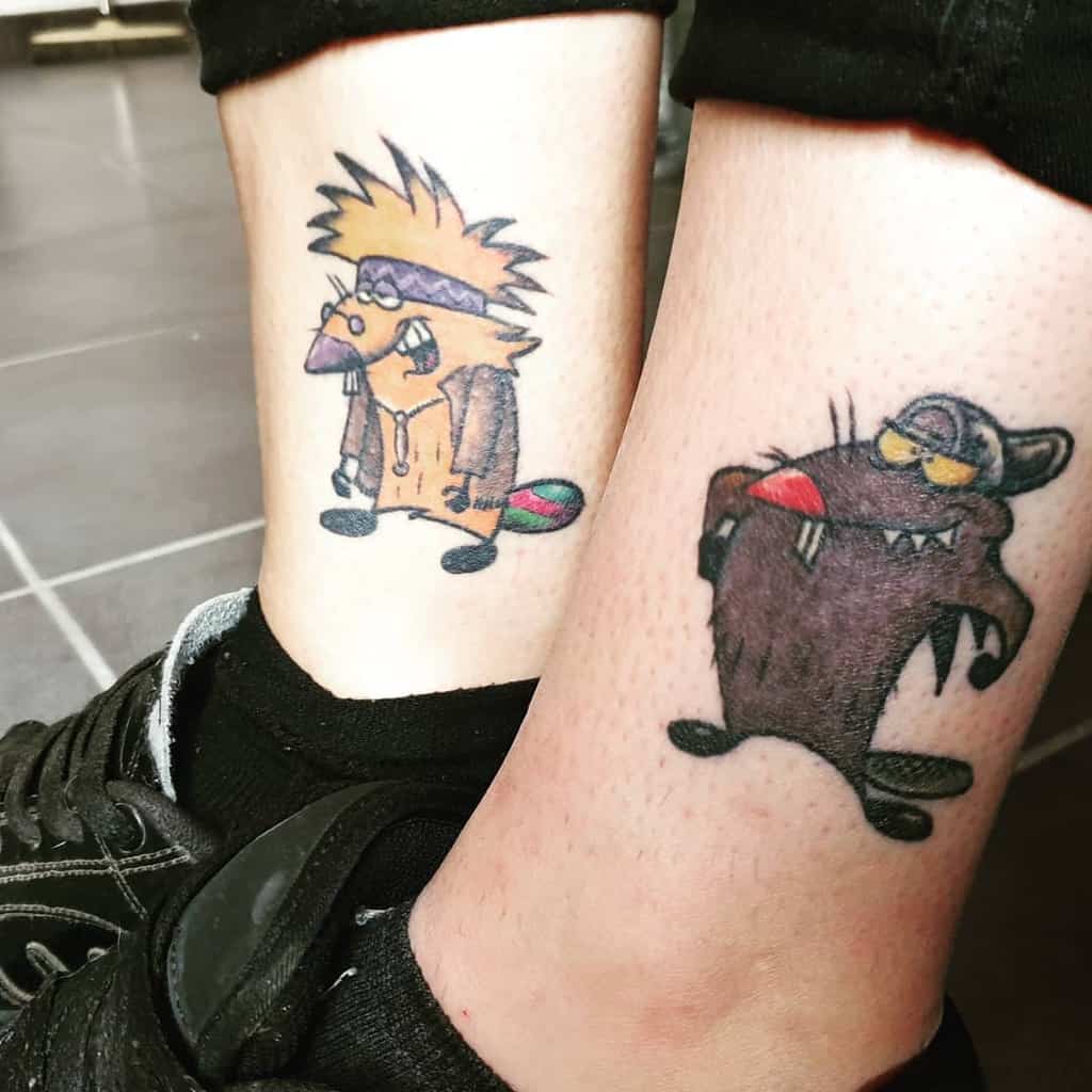 Matching sister tattoos featuring cartoon beaver characters in a colorful and playful style, symbolizing sibling bonds