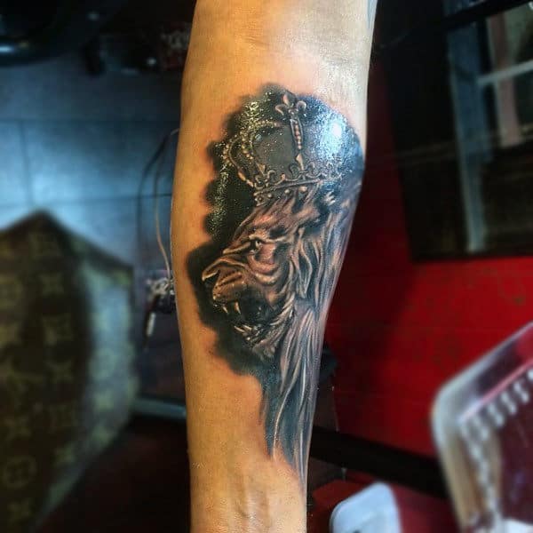 Angry Lion With Sparkling Crown Tattoo On Forearms For Men