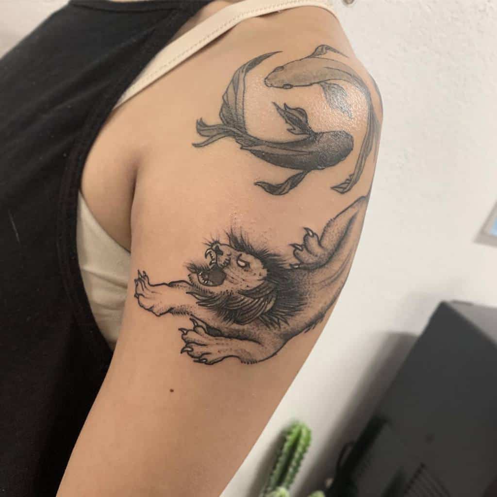 Astrological tattoo of a lion representing Leo and koi fish symbolizing Pisces, blending strength and fluidity.