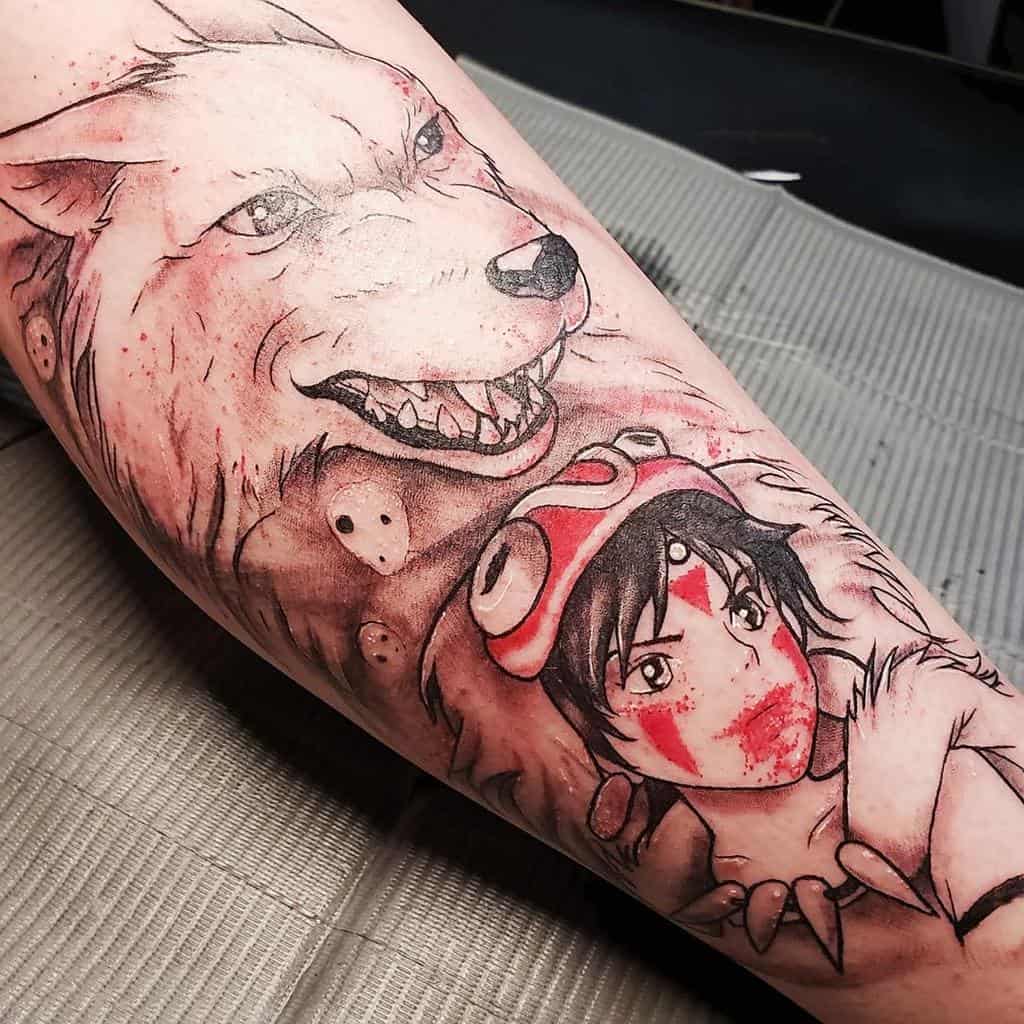 Detailed tattoo of San with blood markings, wearing her wolf pelt, alongside a fierce Moro, accented with red ink and kodama spirits.