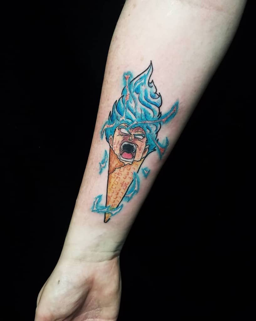 A playful tattoo of Goku in his Super Saiyan Blue form, with his fiery blue hair emerging from an ice cream cone, showcasing a bold, energetic design.