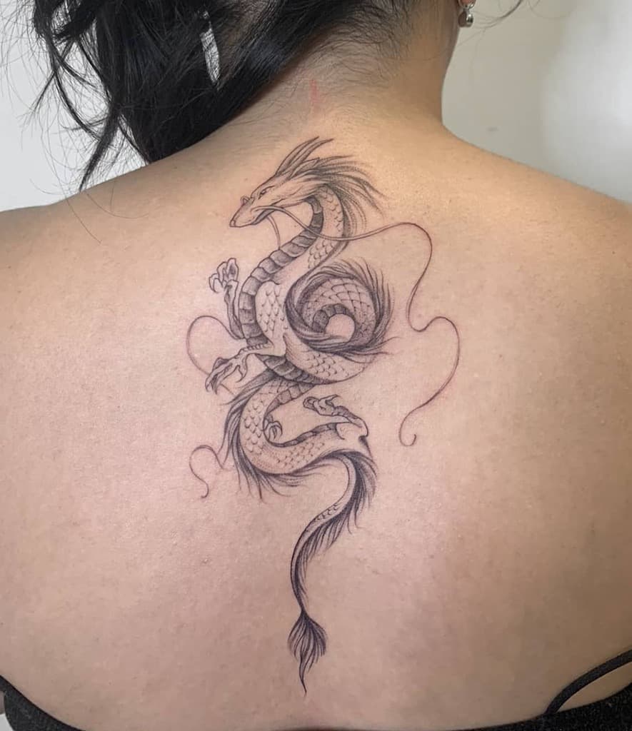 Elegant fine-line tattoo of Haku in dragon form from Spirited Away, flowing with delicate shading and wispy accents