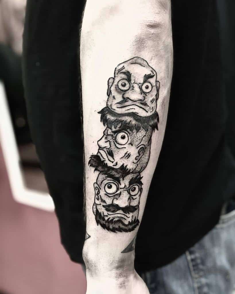 Black and grey tattoo of the bouncing heads from Spirited Away, stacked on top of each other