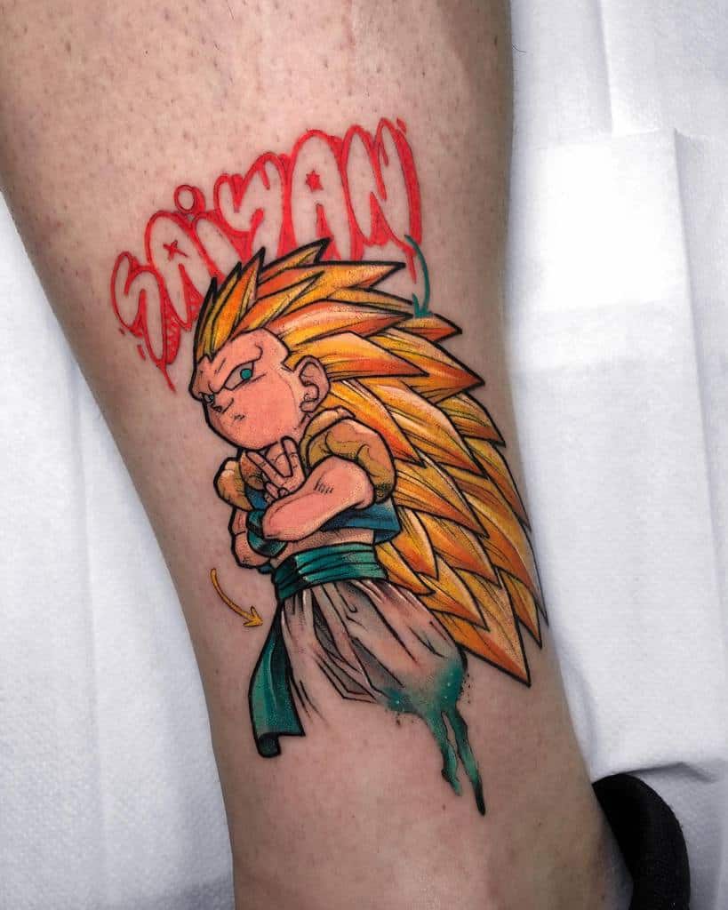A vibrant tattoo of Gotenks, the fusion of Goten and Trunks, with spiky golden hair and a determined expression, accompanied by the bold word "SAIYAN" in dynamic lettering.