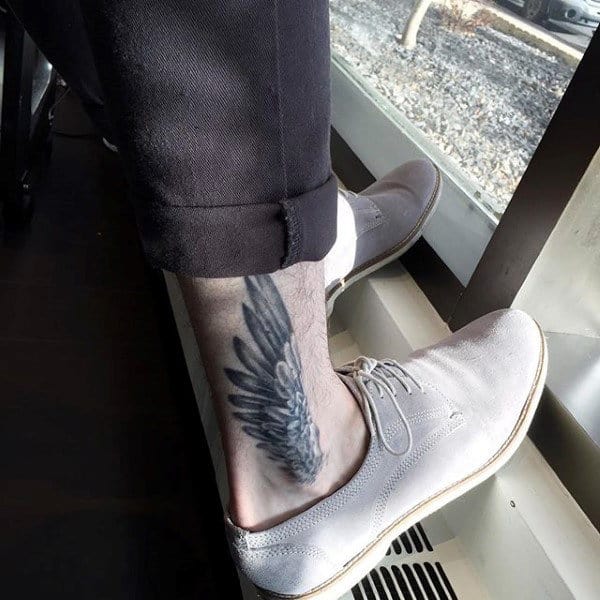 Ankle Hermes Wing Tattoo On Gentleman