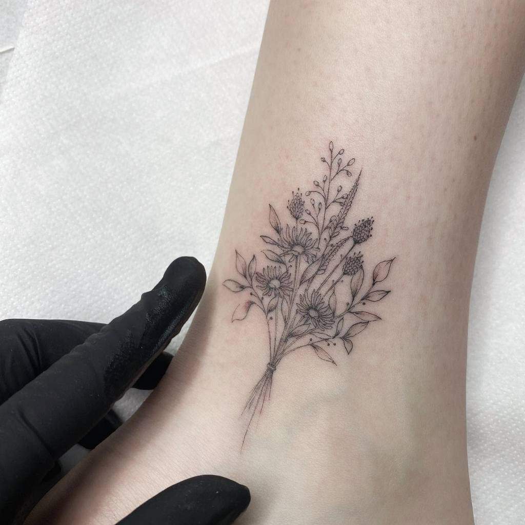 A floral tattoo on an ankle