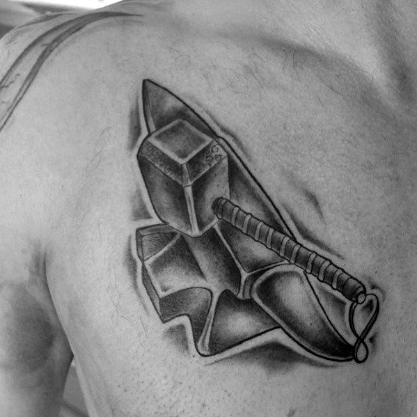 Realistic black and grey tattoo on the chest featuring an anvil and a detailed hammer with a wrapped handle resting on top.