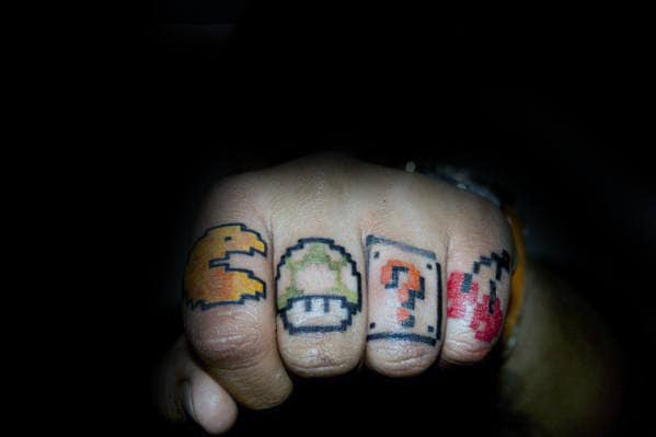Arcade Game Themed Guys Finger Tattoo With Pacman Design