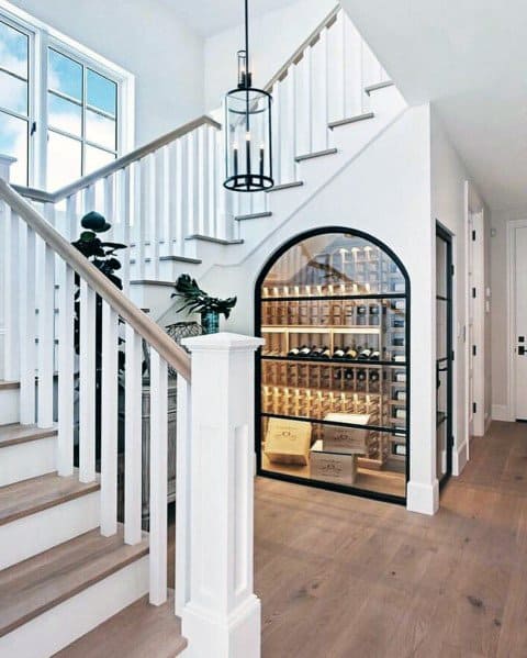 arched wine cellar under stairs