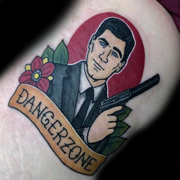 Bold tattoo of Sterling Archer in a suit, holding a gun, with a red backdrop, floral details, and 'Danger Zone' banner.