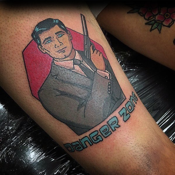 Stylized tattoo of Sterling Archer in a suit, holding a gun, with a red backdrop and 'Danger Zone' text in bold lettering.