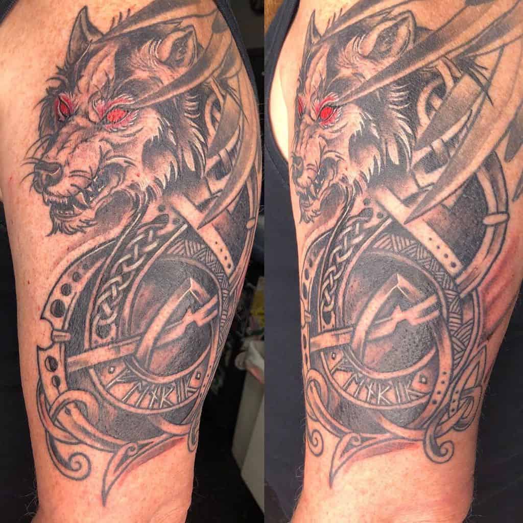 Intricate upper arm tattoo of Fenrir with glowing red eyes, detailed armor, and Nordic knotwork patterns inspired by Norse mythology