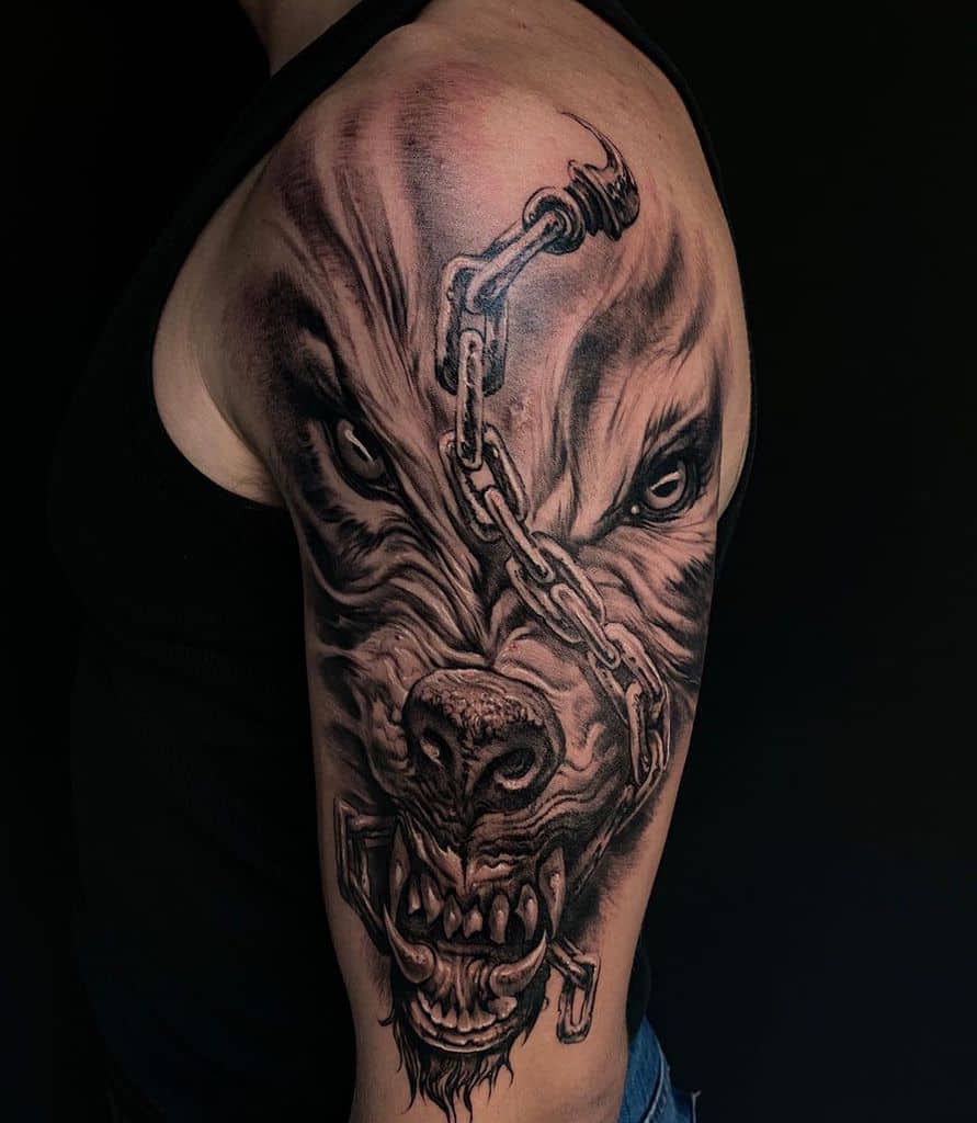 Fierce Norse wolf tattoo with chains, depicting untamed strength and a powerful mythological presence