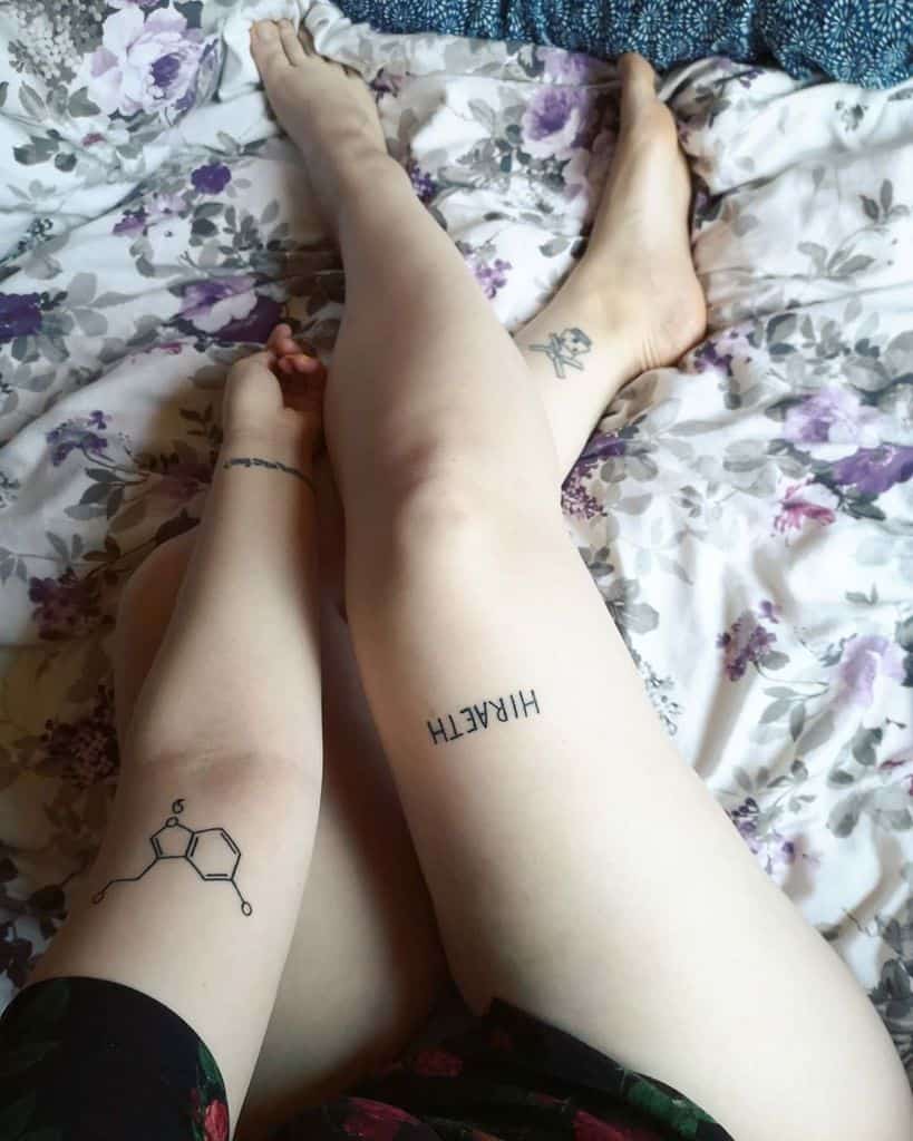Tattoo of a serotonin chemical structure on an upper arm