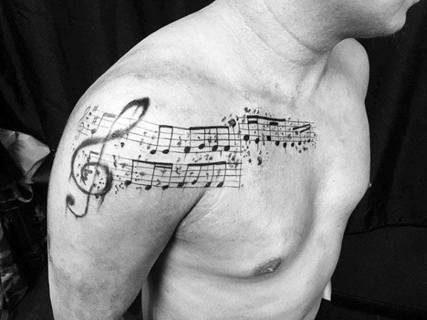 Arm And Chest Incredible Music Staff Tattoos For Men