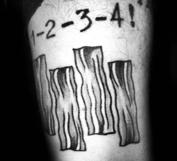 Black Flag tattoo with four wavy vertical bars and the phrase "1-2-3-4!" above, adding a raw punk energy to the design.
