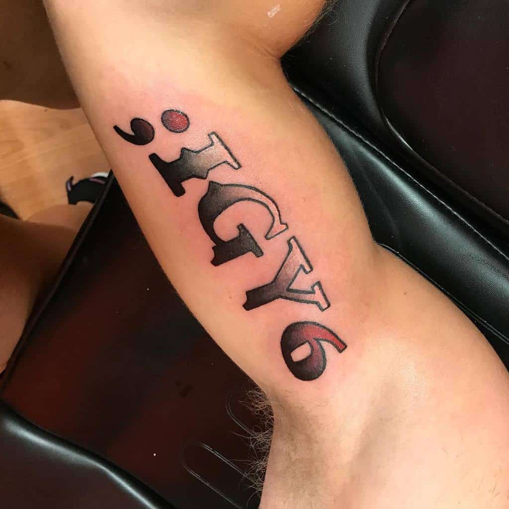 Tattoo on inner bicep reads "; IGY6" in bold black font with red shadowing