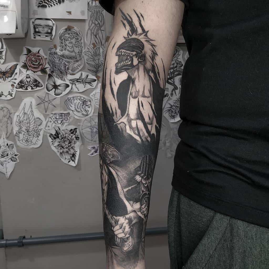 Detailed black and grey sleeve tattoo of Ichigo Kurosaki’s Vasto Lorde form from Bleach, featuring sharp shading and intense expression